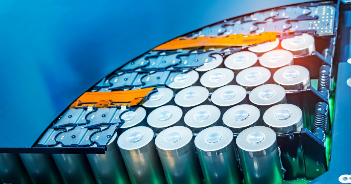 A battery pack with the bottom right corner showing multiple batteries arranged tightly around multiple connectors.